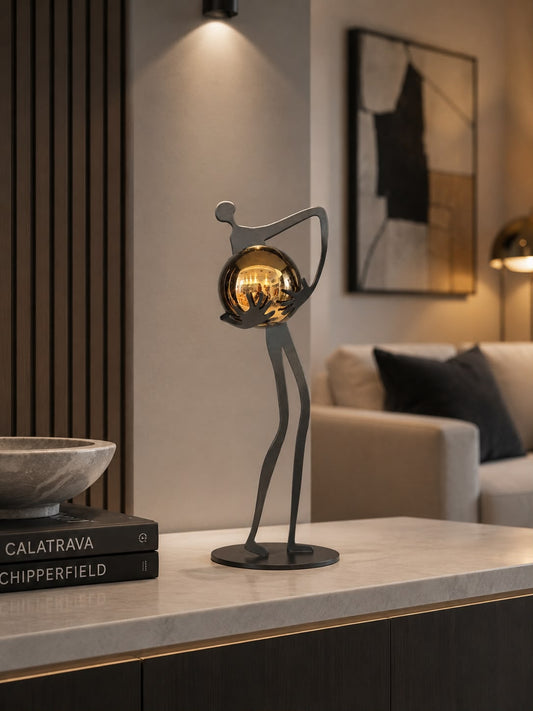 Metal Figure with Golden Sphere